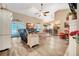 Bright and airy living space with tile floors, vaulted ceilings, a comfortable sofa, and access to outdoor areas at 1500 Wyngate Dr, Deland, FL 32724