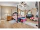 Well-appointed main bedroom with vaulted ceilings, a four-poster bed, and comfortable seating area at 1500 Wyngate Dr, Deland, FL 32724