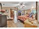 Comfortable main bedroom with vaulted ceilings, a sliding barn door, and views of the ensuite bathroom at 1500 Wyngate Dr, Deland, FL 32724