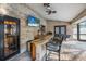 This outdoor bar features brick, a sink, a grill, and a ceiling fan at 1500 Wyngate Dr, Deland, FL 32724