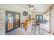 Entertain in this outdoor kitchen with a bar, ceiling fans and brick surround at 1500 Wyngate Dr, Deland, FL 32724
