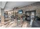 Outdoor kitchen featuring a bar area, ceiling fans and a brick exterior at 1500 Wyngate Dr, Deland, FL 32724