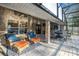 Inviting outdoor living space with a brick patio, comfortable seating, ceiling fan, and a view of the screened-in pool area at 1500 Wyngate Dr, Deland, FL 32724