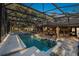 Screened in pool and patio, with a dining area, creating a relaxing oasis for outdoor enjoyment at 1500 Wyngate Dr, Deland, FL 32724