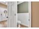 Powder room featuring tiled floors and a white toilet at 1500 Wyngate Dr, Deland, FL 32724