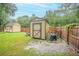 Two backyard storage sheds with access and privacy fencing at 1500 Wyngate Dr, Deland, FL 32724