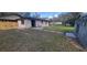 Large backyard featuring a shed, patio area, and stepping stones with ample green space at 165 Franklin Rd, Lake Mary, FL 32746