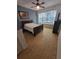 Cozy bedroom featuring a window nook, bed, and ceramic tile flooring at 165 Franklin Rd, Lake Mary, FL 32746