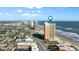 Stunning aerial view of condo building and coastline, with city views at 1900 N Atlantic Ave # 1603, Daytona Beach, FL 32118