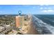 Panoramic aerial view of beachfront condo building, coastline, and city views at 1900 N Atlantic Ave # 1603, Daytona Beach, FL 32118