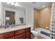 Practical bathroom with a combination shower-tub, granite vanity, and updated fixtures at 1900 N Atlantic Ave # 1603, Daytona Beach, FL 32118
