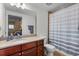 Functional bathroom with a granite vanity, modern fixtures, and combination shower-tub at 1900 N Atlantic Ave # 1603, Daytona Beach, FL 32118