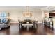A spacious dining room with modern furniture, lighting, and open layout to the kitchen at 1900 N Atlantic Ave # 1603, Daytona Beach, FL 32118
