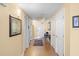 Inviting hallway with neutral colors, tile floor, and tasteful decorations creating a welcoming entrance to the home at 1900 N Atlantic Ave # 1603, Daytona Beach, FL 32118