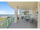 Spacious outdoor balcony with seating, offering ocean views, perfect for relaxation at 1925 S Atlantic Ave # 201, Daytona Beach, FL 32118
