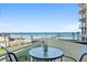 Relaxing balcony featuring ocean and pool views, equipped with cozy seating arrangements at 1925 S Atlantic Ave # 201, Daytona Beach, FL 32118