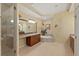 Well lit bathroom featuring a stand up shower, jacuzzi tub, vanity, and tile flooring at 1925 S Atlantic Ave # 201, Daytona Beach, FL 32118