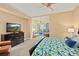 Tastefully furnished bedroom with a view and ensuite patio access at 1925 S Atlantic Ave # 201, Daytona Beach, FL 32118