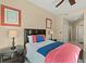 Comfortable bedroom features neutral walls, coordinated decor, and ample natural light at 1925 S Atlantic Ave # 201, Daytona Beach, FL 32118
