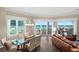 Inviting dining room with glass table and ocean view at 1925 S Atlantic Ave # 201, Daytona Beach, FL 32118