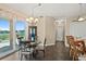 Cozy dining area with balcony, perfect for enjoying meals with a view at 1925 S Atlantic Ave # 201, Daytona Beach, FL 32118