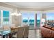 Inviting dining room with glass table and ocean view at 1925 S Atlantic Ave # 201, Daytona Beach, FL 32118