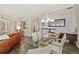 Open concept floor plan with dining table, kitchen, and bar seating at 1925 S Atlantic Ave # 201, Daytona Beach, FL 32118