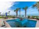 Beautiful tiled fountain with palm trees and ocean views, offering a serene outdoor space at 1925 S Atlantic Ave # 201, Daytona Beach, FL 32118
