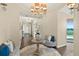 Welcoming foyer with a chandelier, decorative table, and comfortable seating at 1925 S Atlantic Ave # 201, Daytona Beach, FL 32118