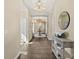 Spacious hallway featuring elegant lighting fixtures and decorative furnishings at 1925 S Atlantic Ave # 201, Daytona Beach, FL 32118
