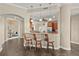 Open-concept kitchen with granite countertops and stainless steel appliances with bar stool seating at 1925 S Atlantic Ave # 201, Daytona Beach, FL 32118