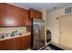 Features stainless steel refrigerator, wood cabinets and double sink at 1925 S Atlantic Ave # 201, Daytona Beach, FL 32118