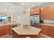 Modern kitchen with granite countertops, stainless steel appliances, and a wine fridge at 1925 S Atlantic Ave # 201, Daytona Beach, FL 32118