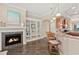 Open floor plan with bar seating, fireplace, and kitchen at 1925 S Atlantic Ave # 201, Daytona Beach, FL 32118