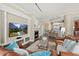 Inviting living room with a fireplace, comfortable seating, and an open floor plan at 1925 S Atlantic Ave # 201, Daytona Beach, FL 32118