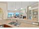 Bright living room with fireplace and access to a balcony with stunning ocean views at 1925 S Atlantic Ave # 201, Daytona Beach, FL 32118
