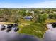 Lakefront home boasting a private pool and mature landscaping on a serene and secluded lot with lake access at 1957 Monterey Dr, Deltona, FL 32738