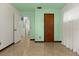 Simple bedroom with minimal decor, natural lighting, and tile floors at 1957 Monterey Dr, Deltona, FL 32738