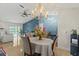 Dining room featuring chandelier and open access to the living room at 1957 Monterey Dr, Deltona, FL 32738