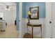 Hallway design featuring a decorative mirror and console table for added style at 1957 Monterey Dr, Deltona, FL 32738