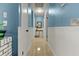 Hallway features neutral paint and classic trim and baseboard details at 1957 Monterey Dr, Deltona, FL 32738
