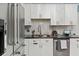 Modern kitchen with stainless steel appliances, granite countertops, and bright white cabinetry at 1957 Monterey Dr, Deltona, FL 32738