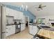 Bright kitchen featuring white cabinetry, stainless steel appliances, and black countertops at 1957 Monterey Dr, Deltona, FL 32738