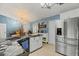 Stylish kitchen with stainless steel appliances, sleek marble countertops, and ample cabinet space at 1957 Monterey Dr, Deltona, FL 32738