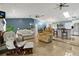Comfortable living room with tile floors, fireplace, modern furnishings and open-concept design to dining area at 1957 Monterey Dr, Deltona, FL 32738