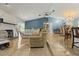 Spacious living area with tile flooring, a fireplace, comfortable seating, and an open layout to the dining area at 1957 Monterey Dr, Deltona, FL 32738