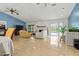 Bright living room boasts tiled floors, vaulted ceilings, and views of the screened-in pool at 1957 Monterey Dr, Deltona, FL 32738