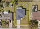 Aerial view of a lovely home with a spacious yard including a trampoline, swing set, and fire pit at 1978 S Old Mill Dr, Deltona, FL 32725