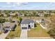 Aerial view of a home with spacious backyard and mature trees and landscaping at 1978 S Old Mill Dr, Deltona, FL 32725