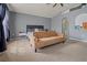 Spacious bedroom featuring a ceiling fan, neutral carpet, a sofa, and natural light at 1978 S Old Mill Dr, Deltona, FL 32725
